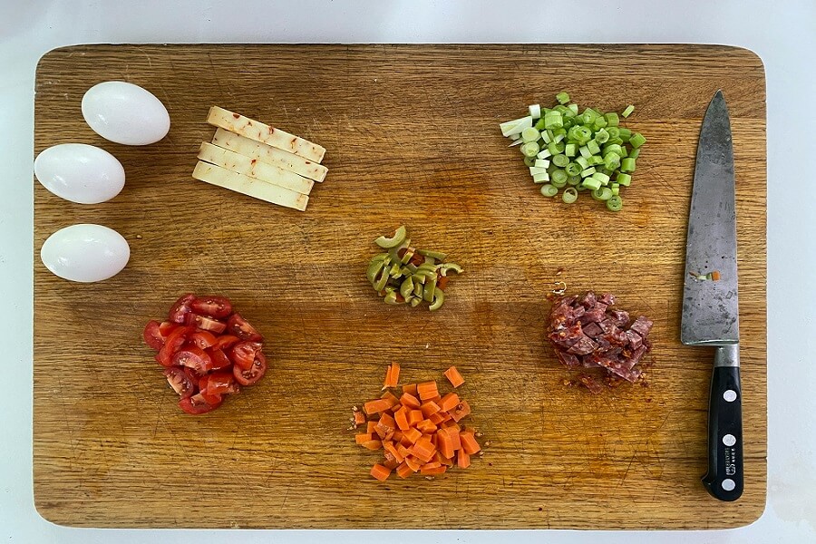 Leafy greens on a wooden board in kitchen daylight, the free Eat Well lever for Healthy Skin